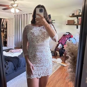 White lace with illusion neckline and nude underlining.